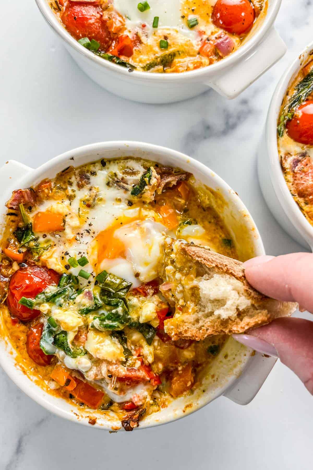 Baked Feta Eggs with Burst Tomatoes and Spinach