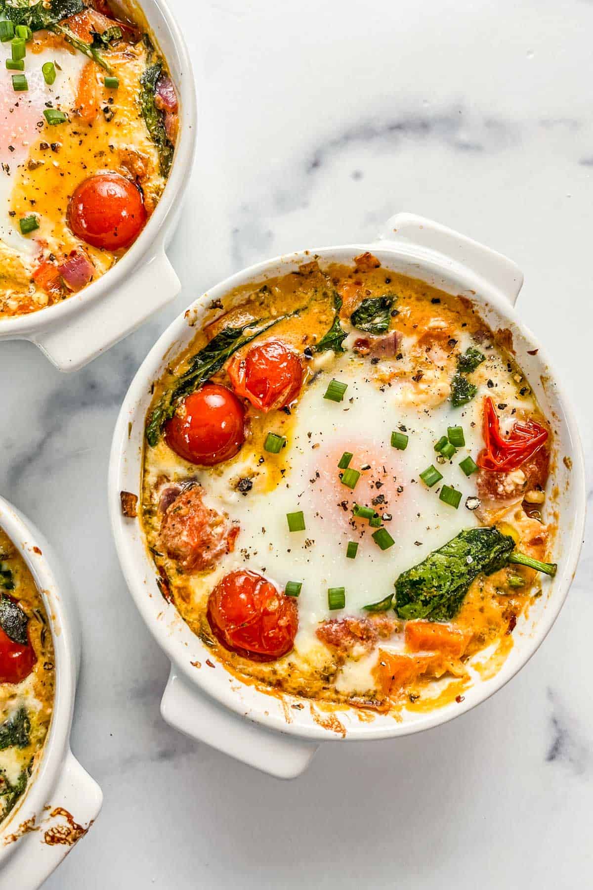 Baked Feta Eggs with Burst Tomatoes and Spinach