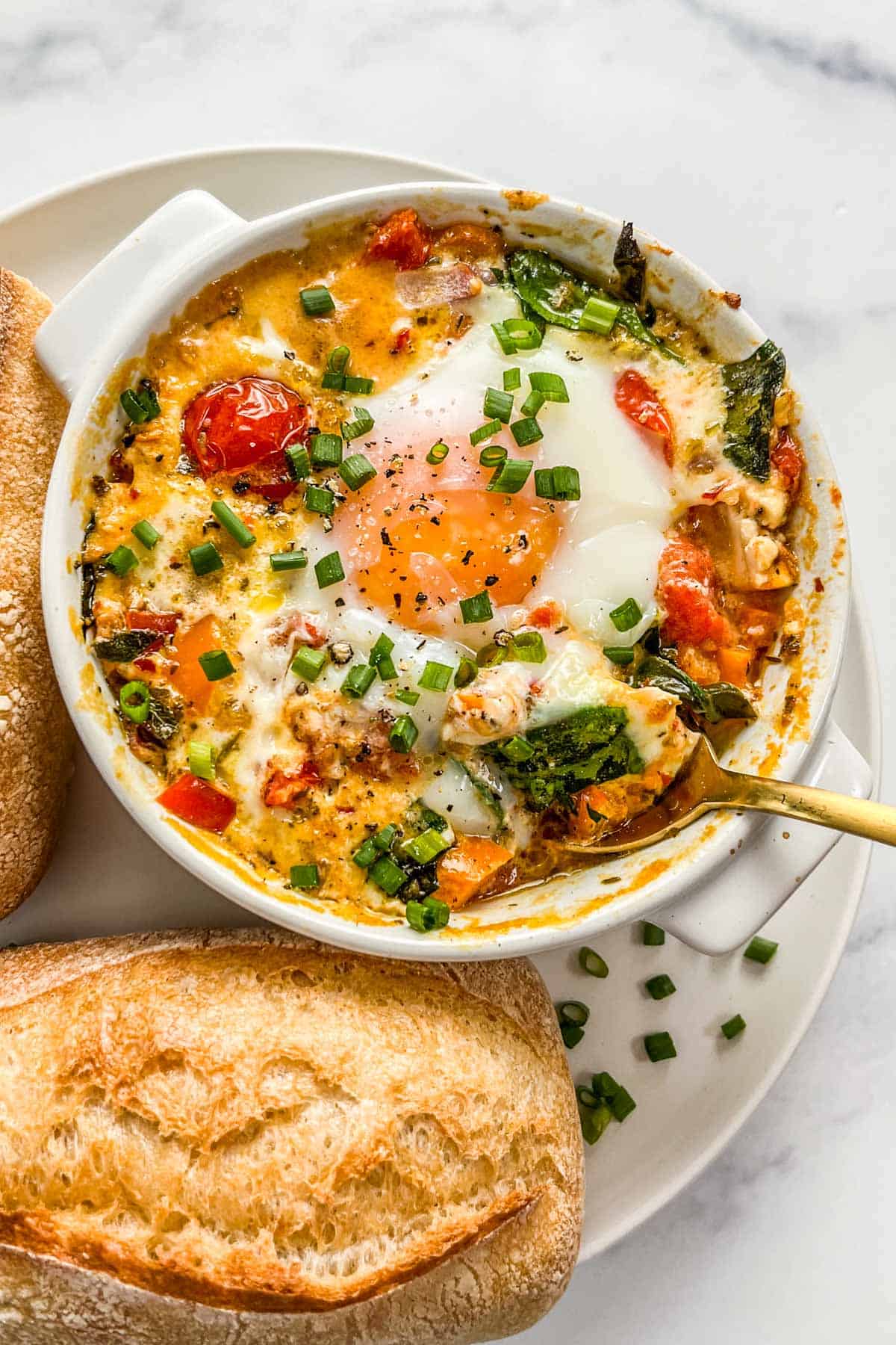 Baked Feta Eggs with Burst Tomatoes and Spinach